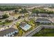 Aerial view of townhomes with community pool and nearby highway at 352 Smugglers Way, Apopka, FL 32712