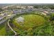 Aerial view of a pond near the townhome community at 352 Smugglers Way, Apopka, FL 32712