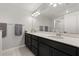 Bathroom features dual sinks and a large mirror with vanity lighting at 352 Smugglers Way, Apopka, FL 32712