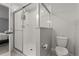 This bathroom features a glass enclosed shower, and a toilet at 352 Smugglers Way, Apopka, FL 32712