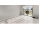 Sunlit room with sliding glass doors leading to balcony at 352 Smugglers Way, Apopka, FL 32712