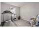 This light and airy bedroom has neutral walls, a window, and grey carpet at 352 Smugglers Way, Apopka, FL 32712