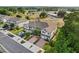 View of townhomes with red shutter accents, brick-paved driveways, and attached one-car garages in a well-maintained community at 352 Smugglers Way, Apopka, FL 32712