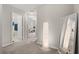 Upstairs hallway featuring a full length mirror and easy access to all bedrooms and bathrooms at 352 Smugglers Way, Apopka, FL 32712