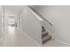 Bright hallway with tile floors, stairway, and view of the living room at 352 Smugglers Way, Apopka, FL 32712