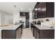 Kitchen with granite countertops, stainless steel appliances, and dark wood cabinets at 352 Smugglers Way, Apopka, FL 32712