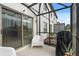This view of the screened patio highlights the ample space for entertaining and outdoor dining at 352 Smugglers Way, Apopka, FL 32712