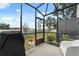 The screened patio offers a private outdoor space, perfect for relaxing or grilling at 352 Smugglers Way, Apopka, FL 32712