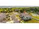 Aerial view of a beautiful home in a community featuring green spaces, lake, and recreation areas at 3575 Landing Net Dr, Kissimmee, FL 34746