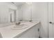 Bathroom vanity featuring dual sinks, modern countertops and stylish fixtures at 3575 Landing Net Dr, Kissimmee, FL 34746