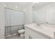 Bright bathroom featuring a shower with stylish curtain and a modern vanity with neutral toned countertop at 3575 Landing Net Dr, Kissimmee, FL 34746