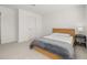 Bright bedroom featuring a modern bed frame and cozy carpeting at 3575 Landing Net Dr, Kissimmee, FL 34746