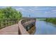 Scenic boardwalk offering tranquil views of the water and natural surroundings; community amenity at 3575 Landing Net Dr, Kissimmee, FL 34746