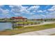 Waterfront community with a long wooden boat dock and lake access at 3575 Landing Net Dr, Kissimmee, FL 34746