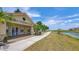 Inviting Boat & Fishing Club clubhouse with stone accents, pathway, and scenic waterfront views at 3575 Landing Net Dr, Kissimmee, FL 34746