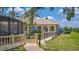 Exterior of a community clubhouse building with an outdoor pool and kid play area at 3575 Landing Net Dr, Kissimmee, FL 34746