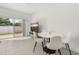 Cozy dining area with modern table and chairs, adjacent to a sliding glass door leading to the patio at 3575 Landing Net Dr, Kissimmee, FL 34746