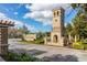 Street view of the community entrance featuring the Bellalago sign and decorative tower at 3575 Landing Net Dr, Kissimmee, FL 34746
