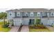Charming multi-Gathering home features a well-maintained exterior, attached garages, and manicured landscaping at 3575 Landing Net Dr, Kissimmee, FL 34746