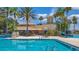 Beautiful pool area with lounge seating, mature palms, and resort-style amenities at 3575 Landing Net Dr, Kissimmee, FL 34746