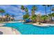 Luxurious pool area featuring a waterslide, multiple pools, and lush landscaping for ultimate relaxation at 3575 Landing Net Dr, Kissimmee, FL 34746