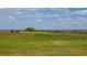 Picturesque view of the community's scenic walkway, marsh, and gazebo overlooking the waterway at 3575 Landing Net Dr, Kissimmee, FL 34746
