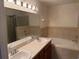 Large bathroom with double sinks, a soaking tub, and a separate shower at 369 St Georges Cir, Eagle Lake, FL 33839