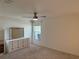 Cozy bedroom with neutral carpet, ceiling fan, and a dresser at 369 St Georges Cir, Eagle Lake, FL 33839