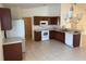 Bright kitchen with stainless steel appliances, tile floor, and plenty of counter space at 369 St Georges Cir, Eagle Lake, FL 33839