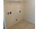 Tiled laundry room ready for washer and dryer at 369 St Georges Cir, Eagle Lake, FL 33839