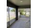 Spacious screened-in patio overlooking the fenced backyard provides space for outdoor entertaining at 369 St Georges Cir, Eagle Lake, FL 33839