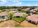 Aerial view showcasing a spacious yard, mature trees, and well-maintained landscaping with a private pool at 3881 Shoreside Dr, Kissimmee, FL 34746