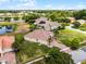 Areal view of a single Gathering home with a brick roof and well-manicured lawn in a desirable neighborhood at 3881 Shoreside Dr, Kissimmee, FL 34746