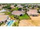 Beautiful aerial view of the home featuring lush landscaping, a private pool, and a well-maintained lawn at 3881 Shoreside Dr, Kissimmee, FL 34746