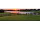 Enjoy the serene lake views and stunning sunset from your backyard at 3881 Shoreside Dr, Kissimmee, FL 34746