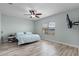 Bedroom with wood-look tile floor, ceiling fan, and a view of the lake at 3881 Shoreside Dr, Kissimmee, FL 34746