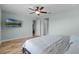 Bedroom with a ceiling fan, and an entertainment center attached to the wall at 3881 Shoreside Dr, Kissimmee, FL 34746