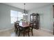 Dining room with wood table, six chairs, chandelier and china cabinet at 3881 Shoreside Dr, Kissimmee, FL 34746
