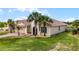 Lovely exterior view highlighting the attached garage, desert landscaping, and classic architectural details of this single Gathering home at 3881 Shoreside Dr, Kissimmee, FL 34746