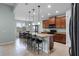 Open kitchen features granite counters, island with seating and pendant lighting at 3881 Shoreside Dr, Kissimmee, FL 34746