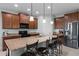 Spacious kitchen with granite countertops, stainless steel appliances, and ample bar seating at 3881 Shoreside Dr, Kissimmee, FL 34746