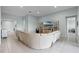 Expansive living area with neutral tile, comfortable seating, and easy access to other rooms in this modern home at 3881 Shoreside Dr, Kissimmee, FL 34746