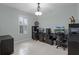 Home office featuring a ceiling fan, and two computer desk workstations for productivity at 3881 Shoreside Dr, Kissimmee, FL 34746