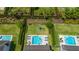 Aerial view of landscaped backyard with pool, spa, playground and well-manicured lawn, perfect for Gathering enjoyment at 420 Burma St, Kissimmee, FL 34747