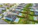 Aerial view of the property highlighting a spacious backyard with pool, spa, and playground, perfect for Gathering living and entertaining at 420 Burma St, Kissimmee, FL 34747