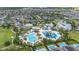 A stunning aerial view highlights the community's water park, pools, and diverse recreational amenities at 420 Burma St, Kissimmee, FL 34747