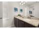 Bathroom with double vanity, granite countertop, and neutral color scheme at 420 Burma St, Kissimmee, FL 34747