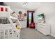 Charming bedroom featuring fun decor, bunkbeds, and a cozy red chair at 420 Burma St, Kissimmee, FL 34747