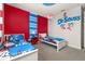 A whimsical themed bedroom featuring twin beds and Dr. Seuss decor at 420 Burma St, Kissimmee, FL 34747