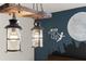Stylish bedroom boasts decorative hanging lights, 'Never Grow Up' themed wall art at 420 Burma St, Kissimmee, FL 34747